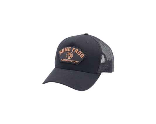 Side facing photo of Bone Frog Ammunition Snapback Trucker Hat Black with Black/Tan PVC Curve Logo sewn on